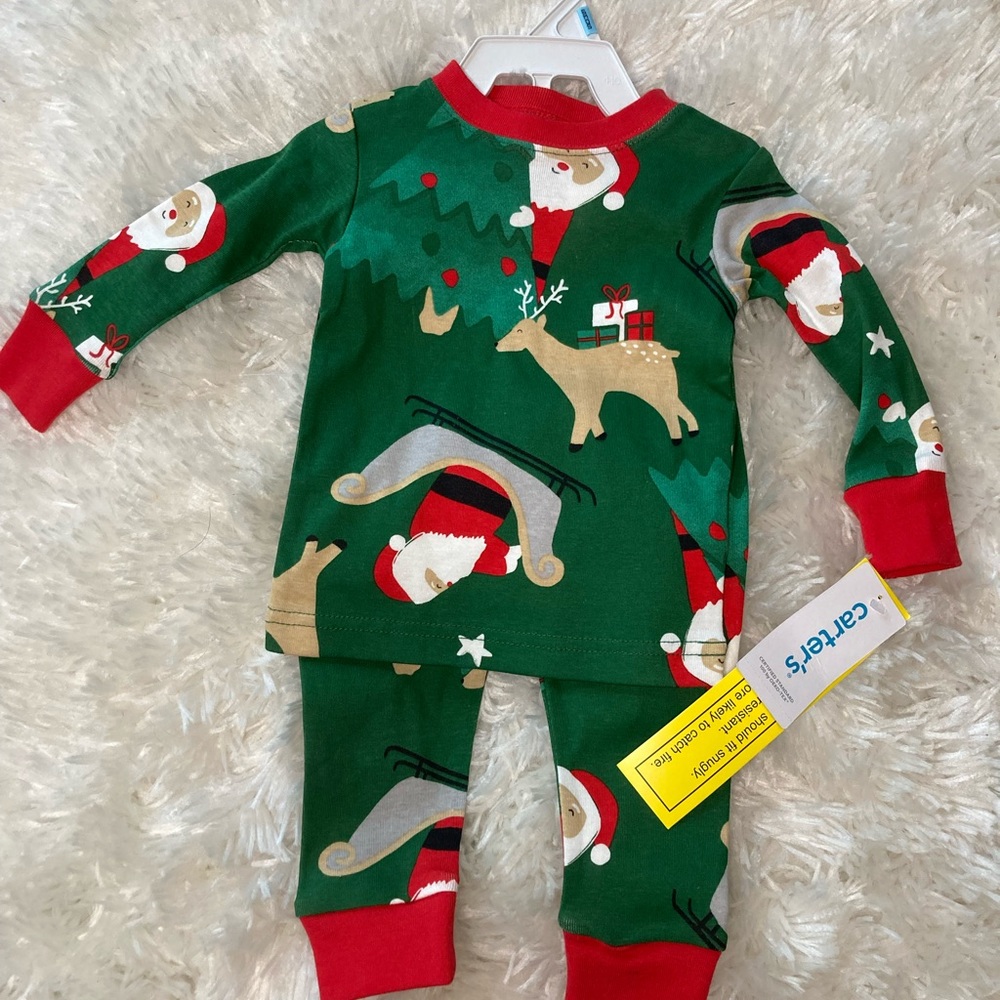 Carter’s 6 month 2 piece Christmas theme pajamas. NWT.
